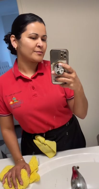 Ilda cleaning a bathroom sink